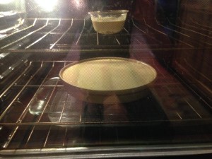 Finally into the oven. Note the little "taster" up top and pan of water at bottom. 